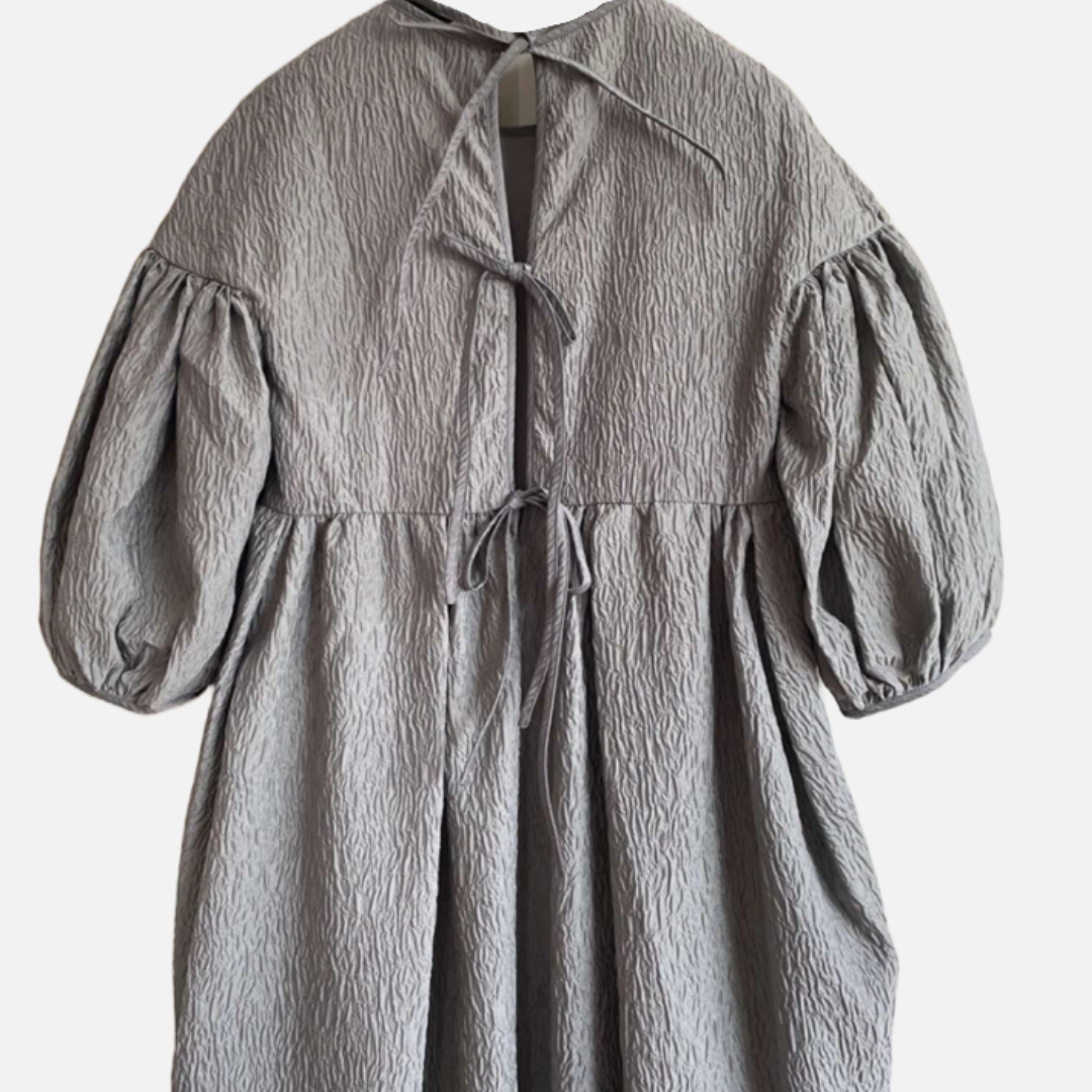 Cecilie Bahnsen Puff Sleeve Dress The Cotswolds Daughter
dove grey designer dress women
Cecilie Bahnsen raised back dress
luxury puff sleeve dress editorial style